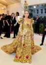 <p> We just know this gown is a look Carrie Bradshaw would be proud of. The golden ensemble the actress wore to the 2018 Met Gala was truly a sight to behold and was perfect for the Heavenly Bodies theme that year. The luxurious gown was courtesy of Dolce & Gabbana and SJP completed the look with a matching ornate headpiece. </p>