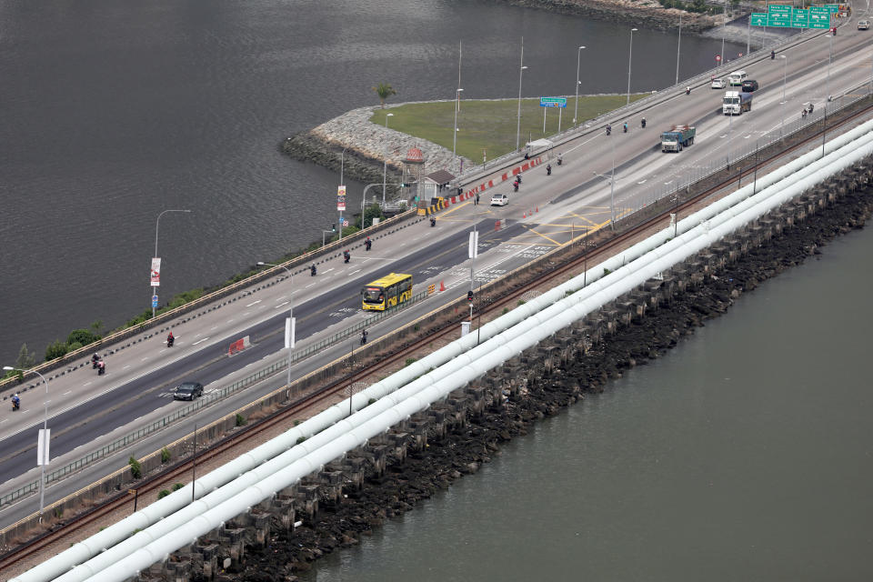 Vehicles travel along the Causeway across the Straits of Johor as seen from Singapore. (Photo: Getty Images)