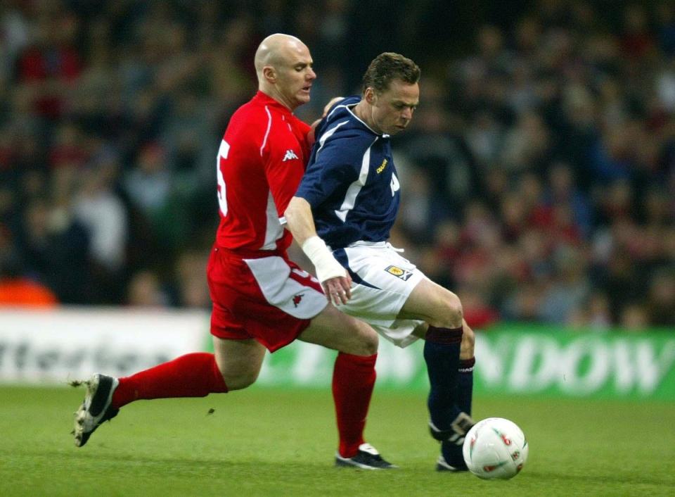 Robert Page, left, in action for Wales against Scotland’s Paul Dickov was a robust defender who won 41 caps for his country (David Davies/PA) (PA Archive)
