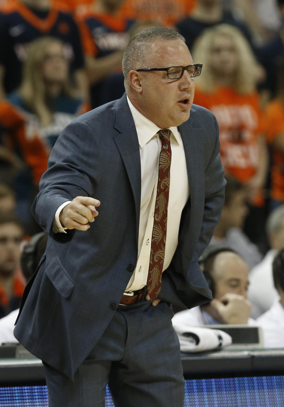 Virginia Tech head coach Buzz Williams directs his team during the first half of an NCAA college basketball game against Virginia, in Charlottesville, Va., Tuesday, Jan. 15, 2019. (AP Photo/Steve Helber)