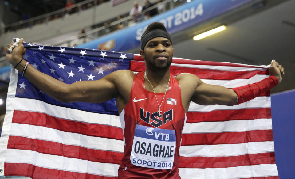 United States' Omo Osaghae celebrates winning the gold medal after the men's 60m hurdles final during the Athletics Indoor World Championships in Sopot, Poland, Sunday, March 9, 2014. (AP Photo/Matt Dunham)