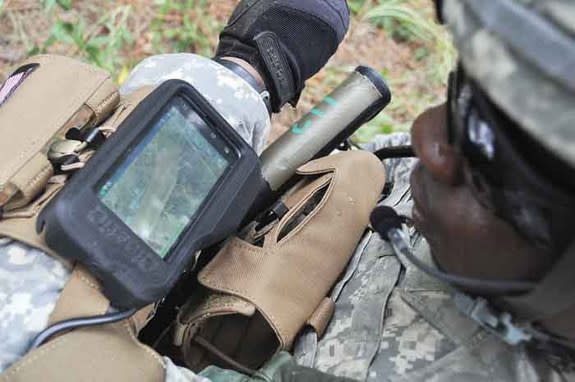 Sgt. Byron Arnold, A Company, 1st Battalion, 29th Infantry Regiment, demonstrates a communication system using the Nett Warrior System Sept. 22 at the McKenna MOUT Site. Such military gadgets could soon get wireless charging under the Army's ne