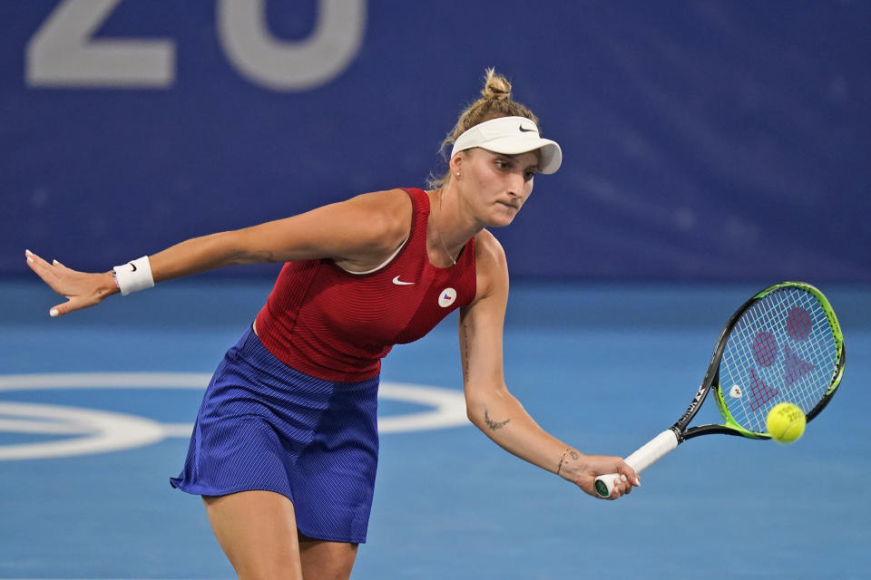 Marketa Vondrousova, of the Czech Republic, plays Naomi Osaka, of Japan, during the third round of the tennis competition at the 2020 Summer Olympics, Tuesday, July 27, 2021, in Tokyo, Japan. (AP Photo/Seth Wenig)