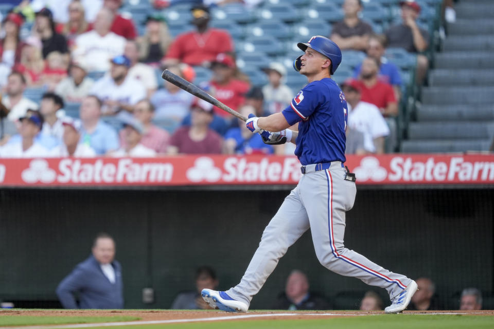 Texas Rangers' Corey Seager watches his two-run home run during the first inning of a baseball game against the Los Angeles Angels, Monday, July 8, 2024, in Anaheim, Calif. (AP Photo/Ryan Sun)