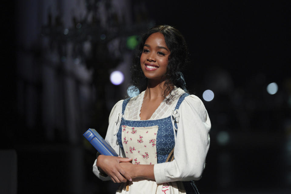 This image released by ABC shows H.E.R. as Belle in "Beauty and the Beast: A 30th Celebration," airing Thursday on ABC. (Christopher Willard/ABC via AP)