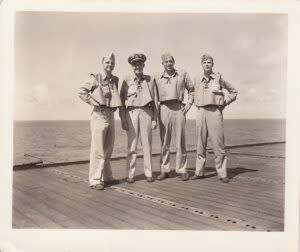  A division of fighter pilots stands on the deck of USS Cowpens. (Provided/Nathan Canestaro)