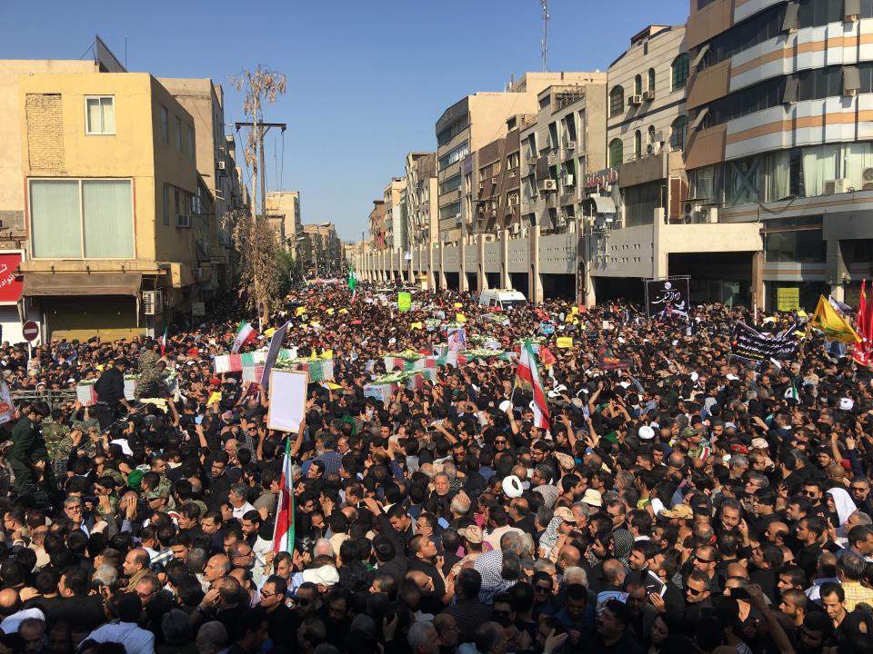 Mourners gather for a mass funeral for those who died in a terror attack on a military parade in Iran in Ahvaz, Iran, Monday, Sept. 24, 2018. Iran on Monday held a mass funeral for those killed in the attack Saturday in the country's oil-rich southwest. (AP Photo/Ebrahim Noroozi)