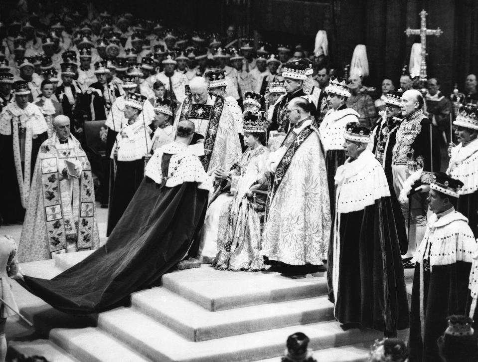 Queen Elizabeth II sits in the Chair of Estate in Westminster Abbey, London on June 2, 1953, before being crowned. (AP Photo)