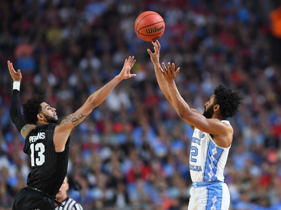 <p>North Carolina Tar Heels guard Joel Berry II (2) shoots over Gonzaga Bulldogs guard Josh Perkins (13) in the second half in the championship game of the 2017 NCAA Men’s Final Four at University of Phoenix Stadium. Mandatory Credit: Bob Donnan-USA TODAY Sports </p>