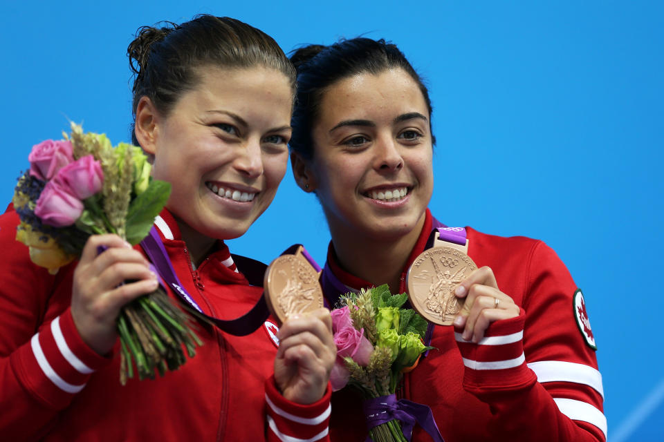 LONDON, ENGLAND - JULY 31: Bronze medallists Roseline Filion and Meaghan Benfeito of Canada pose on the podium during the medal ceremony for the Women's Synchronised 10M Platform Diving on Day 4 of the London 2012 Olympic Games at the Aquatics Centre on July 31, 2012 in London, England. (Photo by Clive Rose/Getty Images)