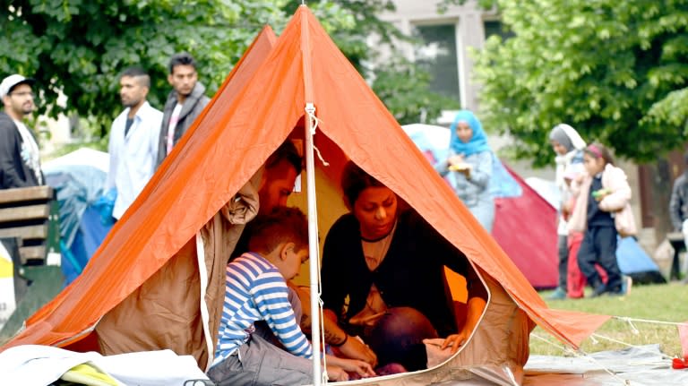 Migrant family with children rest inside their tent in a park in Sarajevo, on May 14, 2018. Migrants are carving a new Balkan route through Bosnia to reach the European Union raising fears of a humanitarian and security crisis in the poor country