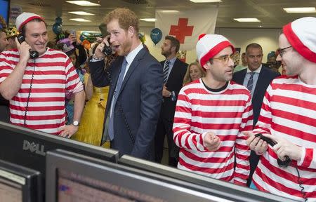 Britain's Prince Harry takes part in a charity trading day at ICAP on the Aus/Nz forwards Desk with Jack O'Brien and Phil McMahon in support of his charity Sentebale, in London, December 7, 2016. REUTERS/Geoff Pugh/Pool