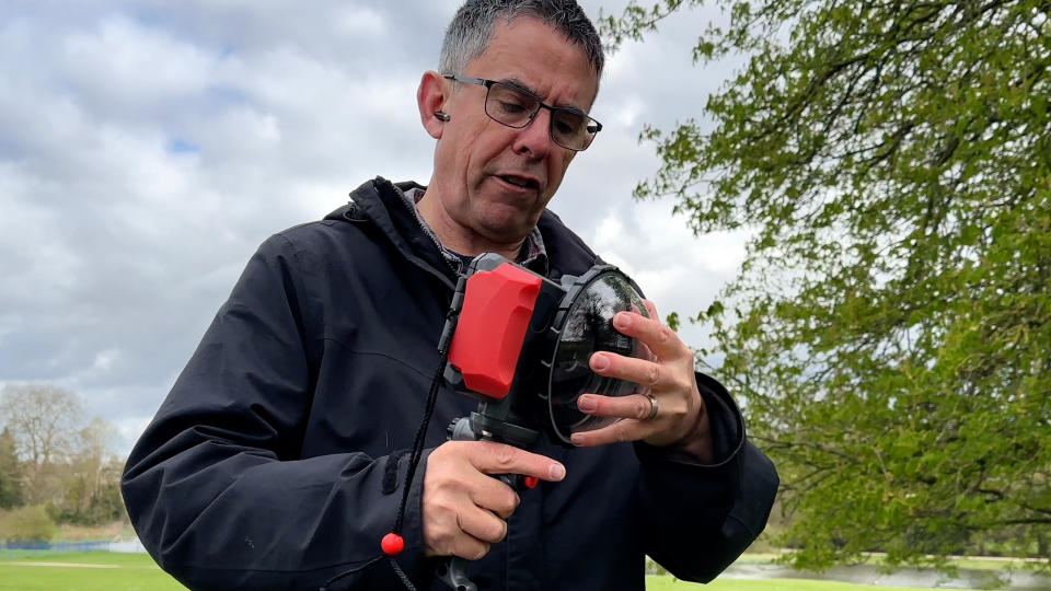 Joby SeaPal waterproof case held in a pair of hands