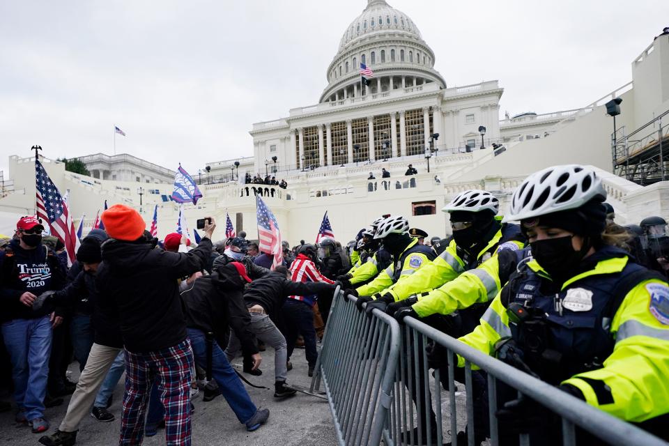 Trump supporters try to break through a police barrier at the U.S. Capitol on Jan. 6, 2021.