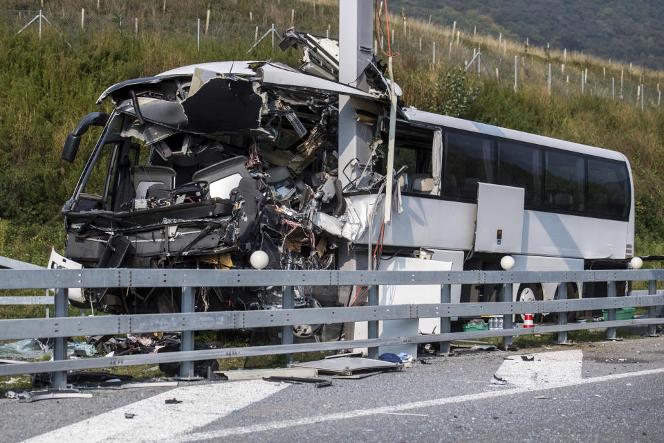 The accident site of a bus that crashed into signal post on the highway A2 in Sigirino, canton of Ticino, Switzerland, Sunday, Oct. 14, 2018. The A2 highway between Rivera and Lugano-North in is closed to the south. Several people were injured in the accident. (Gabriele Putzu, Ti-Press/Keystone via AP)