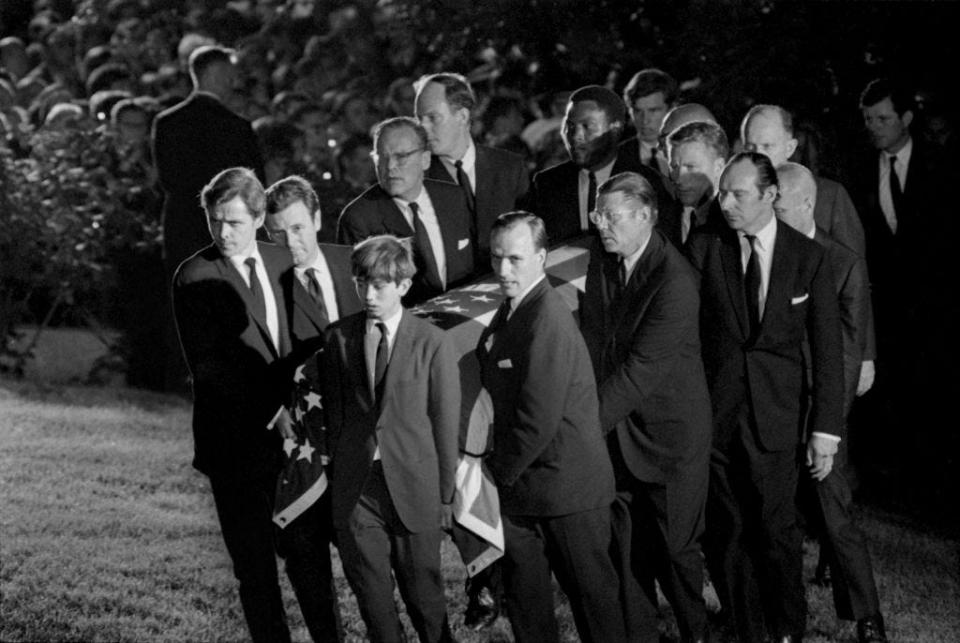 Robert F. Kennedy Jr. (front right) helps carry his father's casket