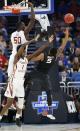 <p>Xavier’s Trevon Bluiett (5) shoots as Florida State forward Jonathan Isaac (1) and center Michael Ojo (50) defend, during the second half of a second-round game of the NCAA men’s college basketball tournament, Saturday, March 18, 2017, in Orlando, Fla. (AP Photo/Wilfredo Lee) </p>