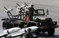 South Korea's Israeli-made Spike missiles (rear) are seen during events to mark the 65th anniversary of Armed Forces Day, at a military airport in Seongnam, south of Seoul, October 1, 2013. The 500 kilometre-range Hyunmoo 2 , 1,000 kilometre-range Hyunmoo 3, and the Spike missiles were unveiled to the public today, according to local media. (REUTERS/Kim Hong-Ji)