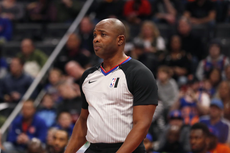 FILE - In this Feb. 8, 2020 file photo, Referee Courtney Kirkland watches during the first half of an NBA basketball game between the Detroit Pistons and the New York Knicks in Detroit. The only instances of NBA referees Kirkland, Tom Washington, Tony Brown all officiating together are some offseason pro-am games in Atlanta, the city they all call home. That will change Sunday, March 7, 2021 The trio was chosen as the officiating crew for this year’s All-Star Game. (AP Photo/Carlos Osorio, File)