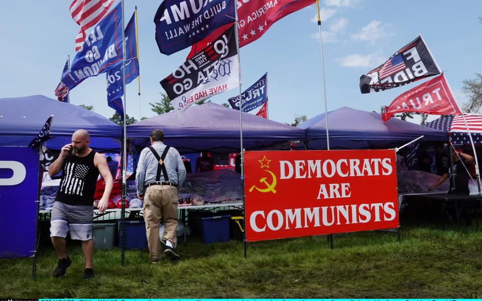 Vendors sell campaign merchandise ahead of a Des Moines rally for Donald Trump on Saturday that was later abandoned because of weather warnings - Scott Olson/Getty Images North America