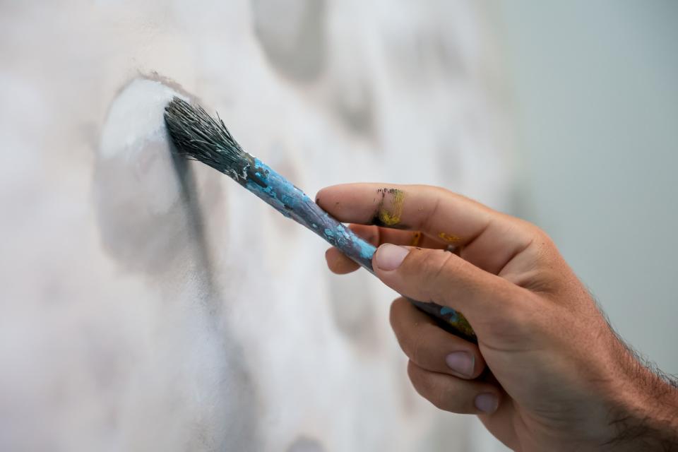 Argentine artist Franco Cervata Cozza, who also goes by the artist name Vato, paints a mural at the George S. and Dolores Doré Eccles Wildlife Education Center in Farmington on Saturday, June 24, 2023. | Spenser Heaps, Deseret News