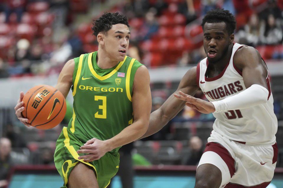 Oregon guard Jackson Shelstad (3) is defended by Washington State guard Kymany Houinsou during the first half of an NCAA college basketball game Saturday, Jan. 6, 2024, in Pullman, Wash. (AP Photo/Ted S. Warren)