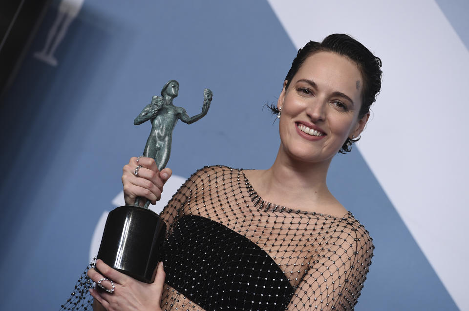 Phoebe Waller-Bridge poses in the press with the award for outstanding performance by a female actor in a comedy series for "Fleabag" room at the 26th annual Screen Actors Guild Awards at the Shrine Auditorium & Expo Hall on Sunday, Jan. 19, 2020, in Los Angeles. (Photo by Jordan Strauss/Invision/AP)