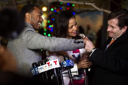 (L-R) Jahi McMath's uncle Omari Sealy, grandmother Sandra Chatman and family attorney Chris Dolan react after speaking with the media outside Children's Hospital and Research Center in Oakland, California, December 30, 2013. REUTERS/Norbert von der Groeben