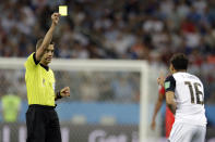 <p>Referee Clement Turpin from France, left, gives Costa Rica’s Cristian Gamboa a yellow card during the group E match between Switzerland and Costa Rica, at the 2018 soccer World Cup in the Nizhny Novgorod Stadium in Nizhny Novgorod , Russia, Wednesday, June 27, 2018. (AP Photo/Natasha Pisarenko) </p>