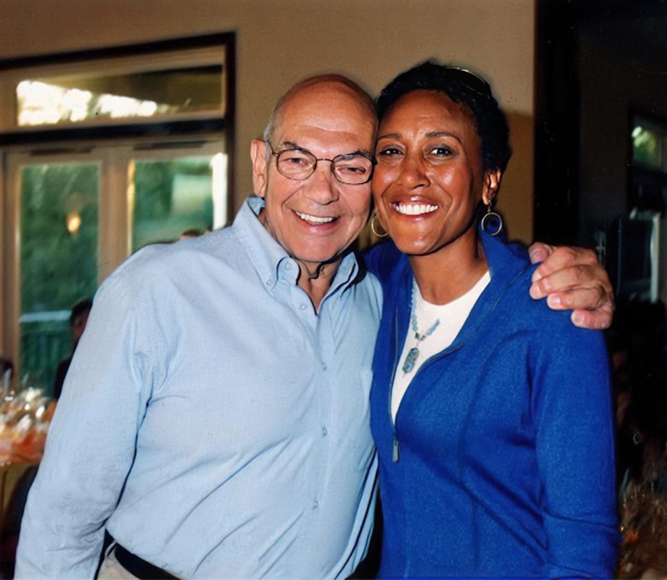 Jim Allegro, a central figure in ESPN’s history and a 1956 Holy Cross graduate, and ESPN's Robin Roberts share a moment. Allegro passed away on New Year’s Eve in St. Augustine, Fla. He was 88.