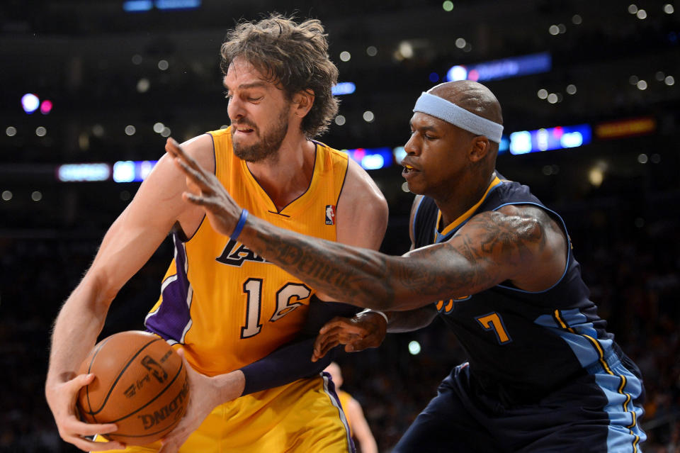 LOS ANGELES, CA - MAY 12: Pau Gasol #16 of the Los Angeles Lakers attempts to move the ball from Al Harrington #7 of the Denver Nuggets in the first half in Game Seven of the Western Conference Quarterfinals in the 2012 NBA Playoffs on May 12, 2012 at Staples Center in Los Angeles, California. NOTE TO USER: User expressly acknowledges and agrees that, by downloading and or using this photograph, User is consenting to the terms and conditions of the Getty Images License Agreement. (Photo by Harry How/Getty Images)