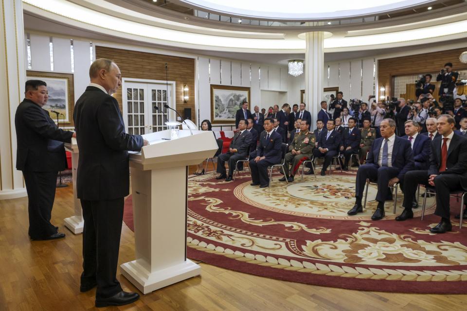 Russian President Vladimir Putin, foreground, and North Korea's leader Kim Jong Un, left, speak to the media after their talks in Pyongyang, North Korea, on Wednesday, June 19, 2024. (Gavriil Grigorov, Sputnik, Kremlin Pool Photo via AP)