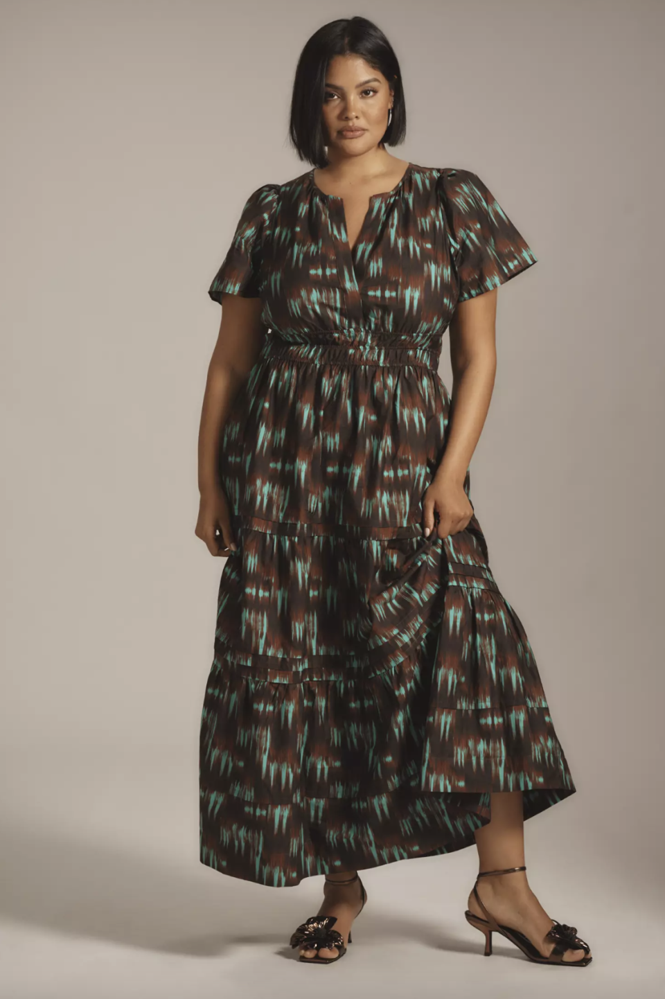 plus size model wearing green and brown The Somerset Maxi Dress (Photo via Anthropologie)