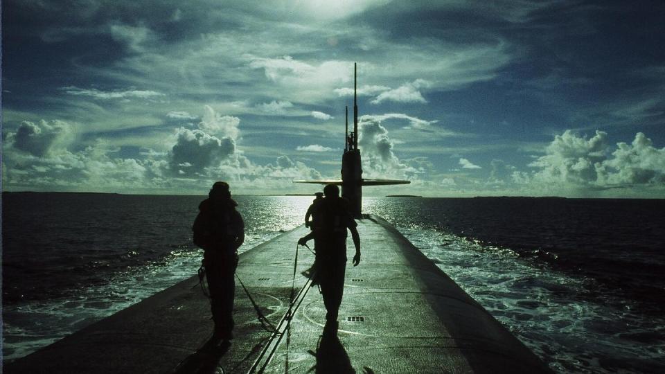Sunrise over the Marshall Islands. Bill Kammer, left, and Stan Jankowski in the background. (Photo courtesy of David Chetlain)