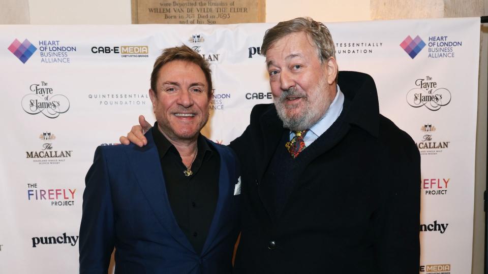 Simon Le Bon (L) and Stephen Fry attend The Fayre of St James's Christmas Carol Concert 