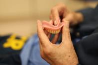 Louis Henson, 74, has his dentures fixed at the California Health Care Facility in Stockton, California, U.S., May 24, 2018. REUTERS/Lucy Nicholson