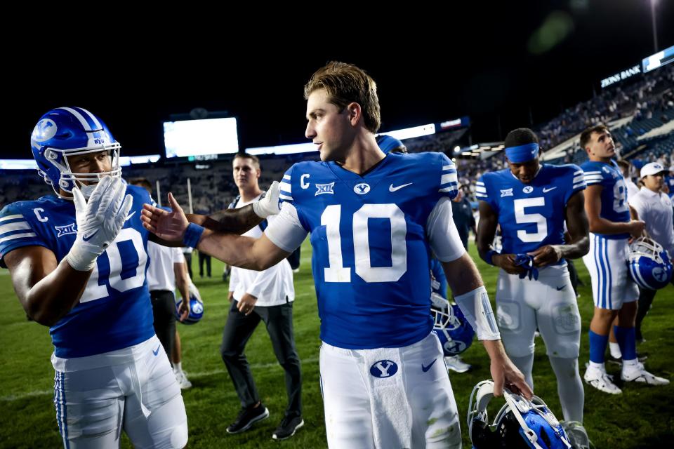 BYU linebacker AJ Vongphachanh, left, and QB Kedon Slovis celebrate after their win over the Sam Houston Bearkats.