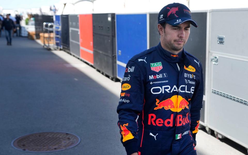 Red Bull Racing's Sergio Perez, of Mexico, walks through the paddock after his car failed during the Canadian Grand Prix auto race in Montreal, Sunday, June 19, 2022 - Ryan Remiorz/The Canadian Press