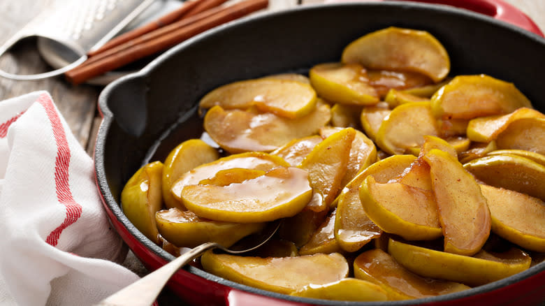Cooked apple slices in skillet