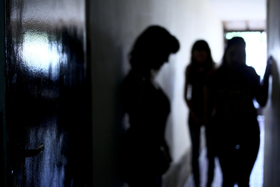 FILE - In this Dec. 16, 2016 file photo, three alleged victims of priest Nicola Corradi pose for a photo during an interview in Mendoza, Argentina. Judges are scheduled to rule Monday, Nov. 26, 2019, in the case of two priests who face up to 50 years in prison for alleged sexual abuse of deaf children at a Catholic-run school, a sister institution to a school that suffered a similar scandal in Italy. (AP Photo/Marcelo Ruiz, File)