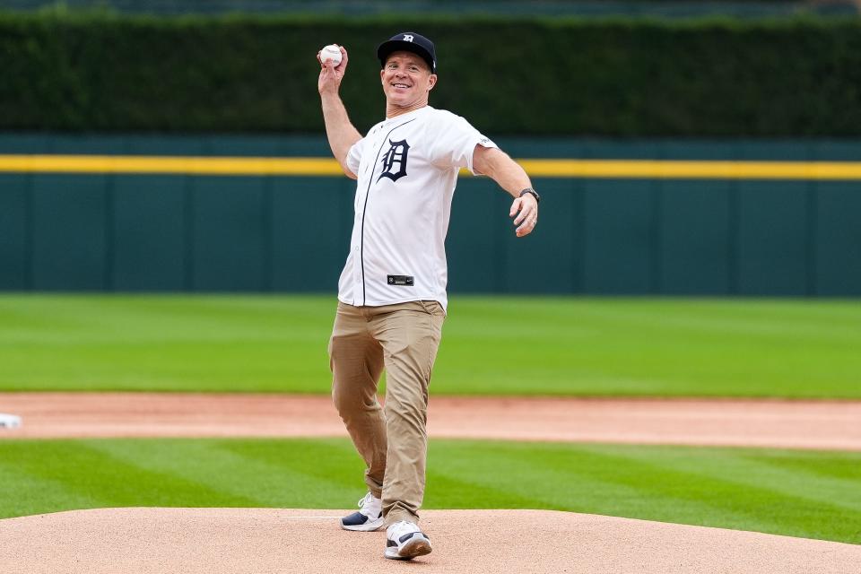 Michigan basketball head coach Dusty May throws the ceremonial first pitch before a game between Detroit Tigers and Chicago White Sox at Comerica Park in Detroit on Sunday, Sept. 29, 2024.