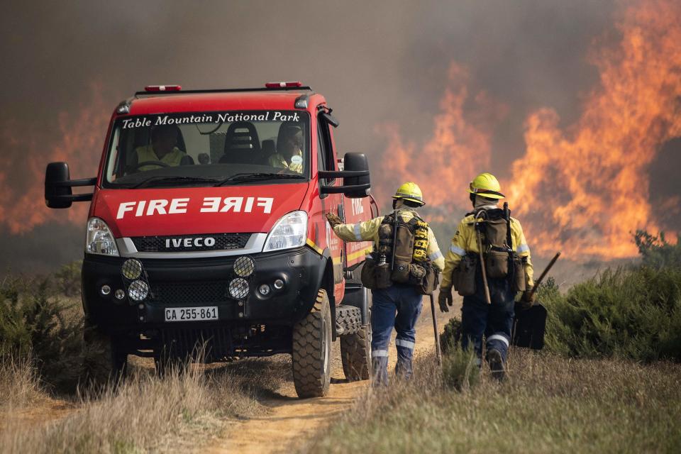 Firefighters on the foothills of Table MountainAFP via Getty Images