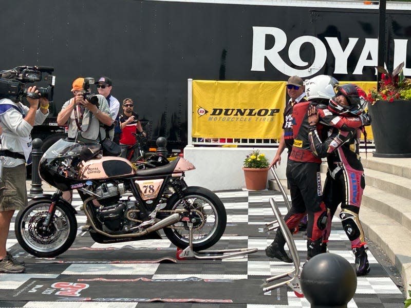 The camaraderie between this particular group of riders is admirable. Moore hugging another rider before the podium ceremony.