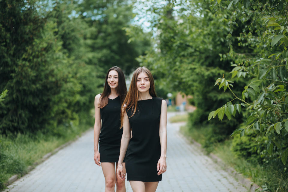 Two-Young-Women-In-Little-Black-Dresses-Stock-Photo