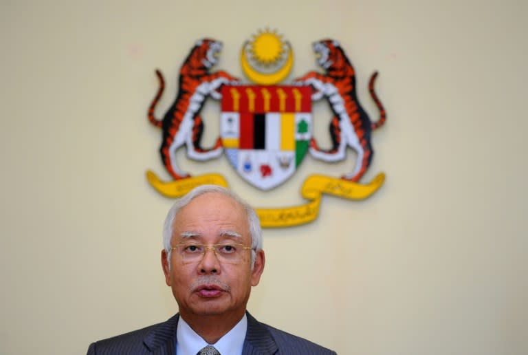Malaysia's Prime Minister Najib Razak addresses a press conference at his office in Putrajaya on July 28, 2015 amid 1MDB corruption allegations