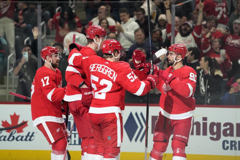 The Detroit Red Wings celebrate a goal by left wing Elmer Soderblom, second from left, during the third period of against the Tampa Bay Lightning at Little Caesars Arena in Detroit on Wednesday, Dec. 21, 2022.