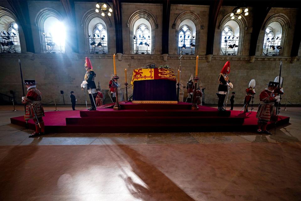 Britain's Queen Elizabeth II Lies in State on a Catafalque inside an empty Westminster Hall, at the Palace of Westminster, in London on September 14, 2022, ahead of the public being allowed in to pay their respects. - Queen Elizabeth II will lie in state in Westminster Hall inside the Palace of Westminster, from Wednesday until a few hours before her funeral on Monday, with huge queues expected to file past her coffin to pay their respects.