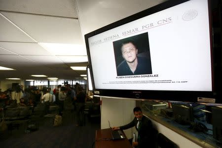 A mugshot of Ruben Oseguera Gonzalez is displayed on a screen during a news conference at Interior Ministry in Mexico City June 23, 2015. REUTERS/Edgard Garrido