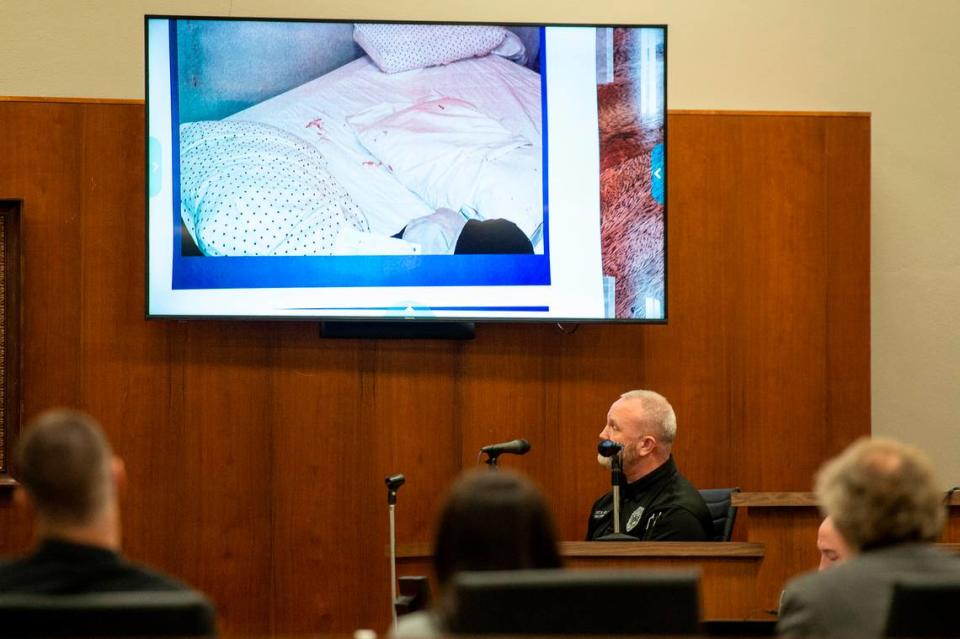 A photograph from the murder scene is shown to witness Sgt. Robert Jolly during trial at Harrison County Circuit Court in Biloxi on Tuesday, March 8, 2022.