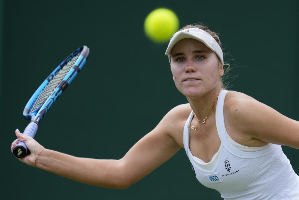 Sofia Kenin of the US returns to China's Wang Xinyu in a women's singles match on day four of the Wimbledon tennis championships in London, Thursday, July 6, 2023. (AP Photo/Kirsty Wigglesworth)